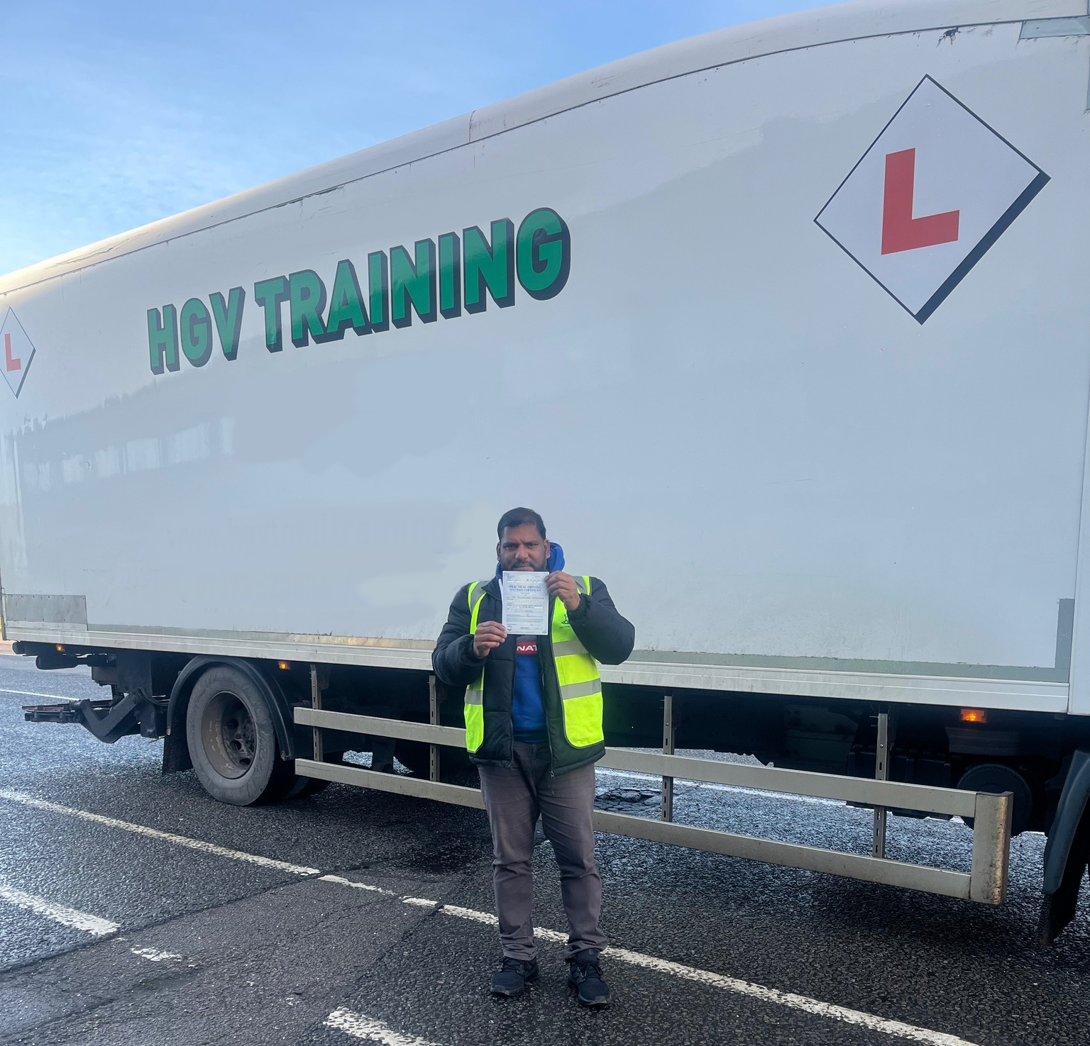 A blue rigid training truck
